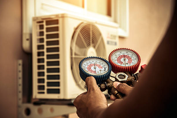 Professional Heat Pump Repair technician working in Tompkinsville, KY